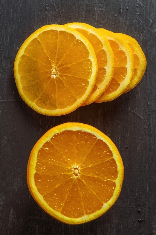 a close up of sliced oranges on a table, by Dietmar Damerau, process art, high detail product photo, dark orange, packshot, close-up product photo