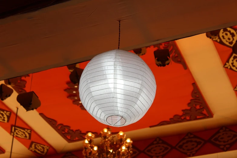 a chandelier hanging from the ceiling of a restaurant, a photo, inspired by Edo Murtić, flickr, ball shaped accordion sleeve, lantern, stage light, white plastic