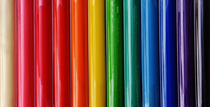 a close up of a bunch of colored pencils, a picture, flickr, color field, colorful glass wall, rainbow tubing, vinyl material, green blue red colors
