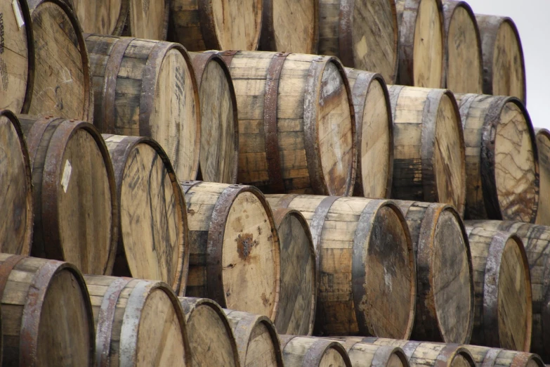 a bunch of wooden barrels stacked on top of each other, a portrait, by Robert Brackman, flickr, whisky, 2 0 1 0 photo, yummy, in rows