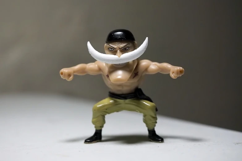 a close up of a figurine of a man with a mustache, a picture, inspired by Eiichiro Oda, combat stance, early cuyler, supersharp photo, micro pov