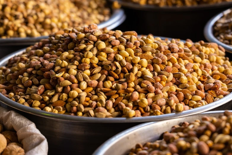 a bunch of bowls filled with lots of nuts, a portrait, renaissance, uttarakhand, high res photo, vibrant atmosphere, luscious with sesame seeds