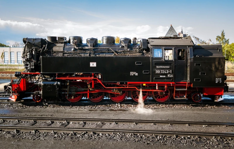 a close up of a train on a train track, by Jörg Immendorff, brass and steam technology, beautiful day, 6 4 0, big engine