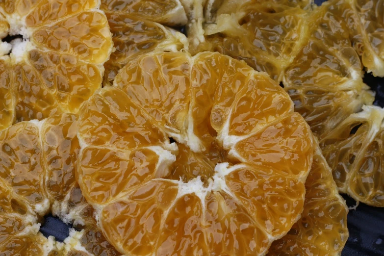 a close up of a bunch of orange slices, by Dietmar Damerau, process art, honeycomb, glazed, detailed innards, bright morning