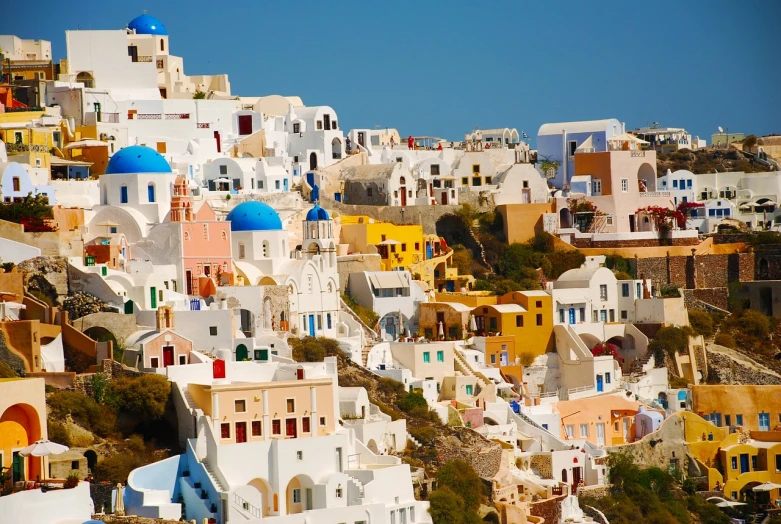 a bunch of buildings that are on the side of a hill, by Paul Emmert, shutterstock, renaissance, santorini, low saturation colors, high details!, colorful”