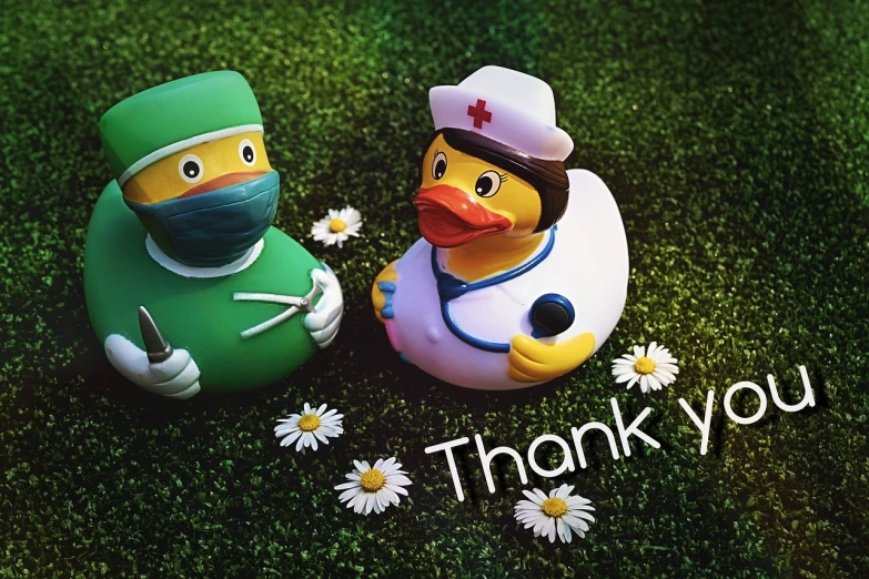 a couple of rubber ducks sitting next to each other, a colorized photo, pixabay, process art, thank you very much, healthcare worker, holding a 🛡 and an 🪓, #green