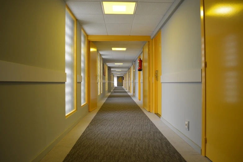 a long hallway in a building with yellow doors, a portrait, 130mm, carpet, nursing home, fluorescent led