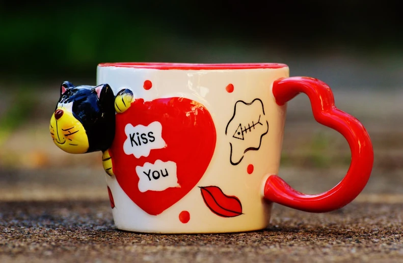 a close up of a coffee cup with a cat on it, by Bálint Kiss, pixabay, pop art, kissing together cutely, red and white and black colors, cute pocelain doll, lipstick
