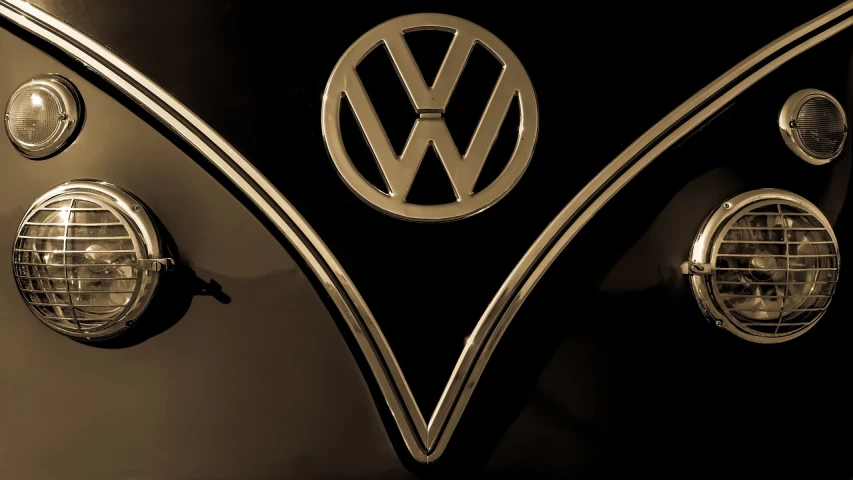a black and white photo of a vw bus, a picture, inspired by Harry Haenigsen, unsplash, art nouveau, made of polished broze, closeup!!!!!!, iconic logo symbol, sepia