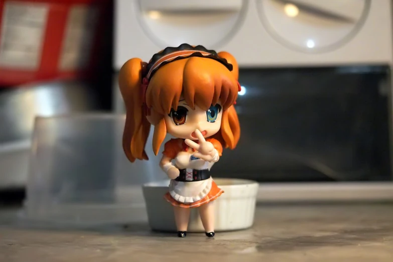 a close up of a doll on a counter, a picture, inspired by Fujiwara Takanobu, pixiv, orange and white, kneeling!!, 2 4 mm wide angle, d-cup