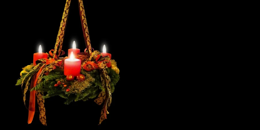 a bunch of candles sitting on top of a christmas wreath, a photo, by Jesper Knudsen, digital art, two hang, widescreen, with a black background, ribbon