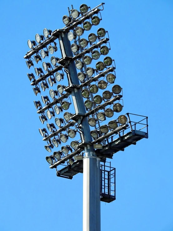 a tall light tower with lots of lights on top of it, a portrait, shutterstock, sports setting, detailed zoom photo, osr, light cone