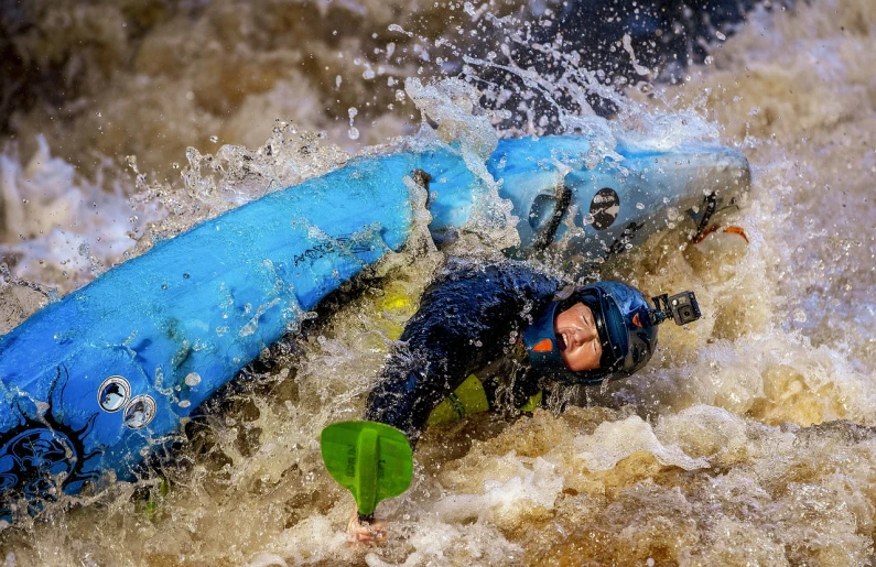 a man riding a wave on top of a surfboard, a photo, by Arnie Swekel, pixabay contest winner, crawling in a wet sewer pipe, rapids, mud, blue