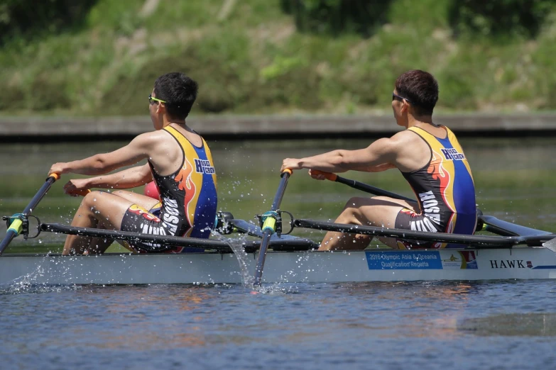 a couple of men riding on top of a boat, a portrait, by Dietmar Damerau, flickr, bauhaus, in a race competition, cute boys, 2 0 2 2 photo, jesper esjing