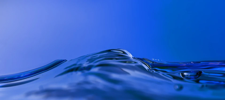 a close up of a water wave on a blue background, a picture, by Jan Rustem, highly detailed product photo