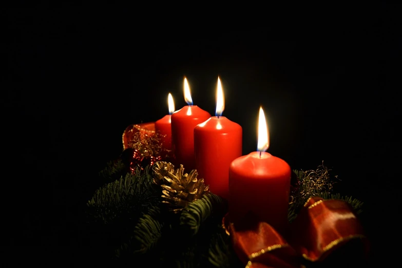 a group of red candles sitting on top of a christmas tree, a portrait, by Alexander Fedosav, pixabay, hurufiyya, on a dark background, pray, orange candle flames, stock photo
