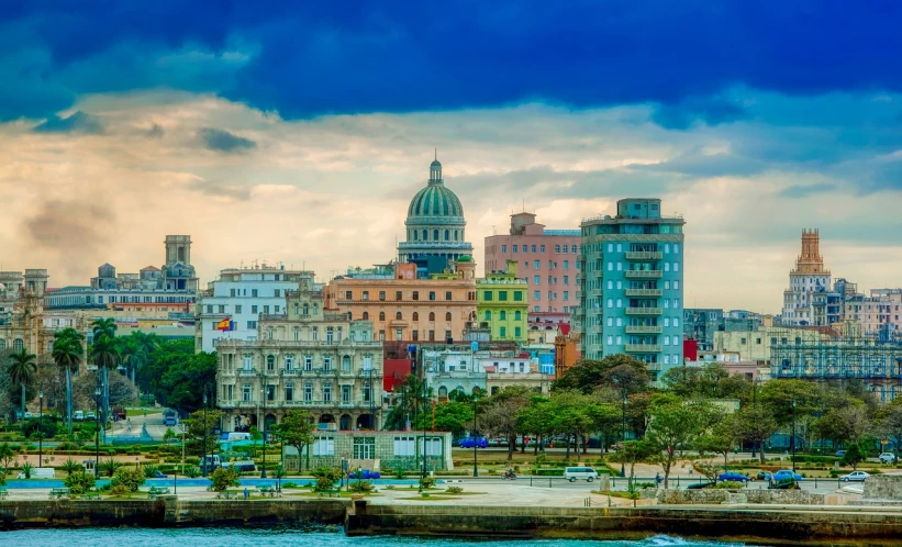 a large body of water with a bunch of buildings in the background, a photo, by Luis Miranda, shutterstock, fine art, cuban setting, 1128x191 resolution, hq 4k phone wallpaper, broadway