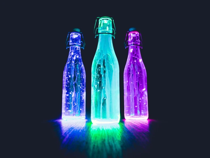 a group of three bottles sitting next to each other, a hologram, pexels, luminous color’s, !!beautiful!!, sprays, cinematic colors lighting