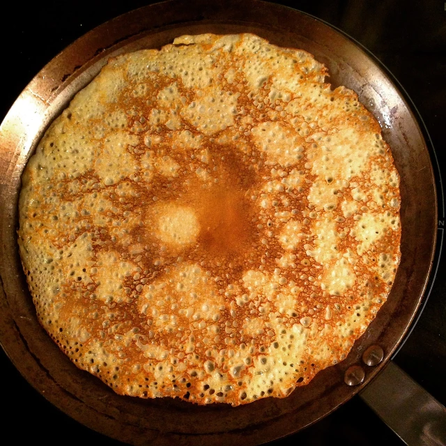 a pan filled with food sitting on top of a stove, a stipple, by Jason Felix, flickr, hurufiyya, pancakes, bottom - view, recipe, pastelle