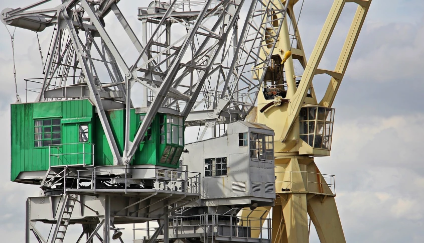 a couple of cranes that are next to each other, by Sven Erixson, flickr, constructivism, ship interior, ( ferris wheel ), hull, [ closeup ]!!