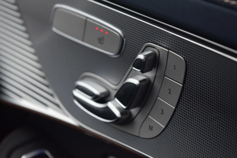 a close up of a car door handle, les automatistes, front left speaker, mercedes, control panel, efficient