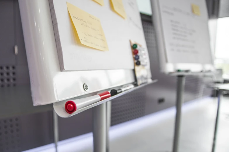 a white board with post it notes attached to it, silver white red details, product showcase, close-up shot from behind, platforms