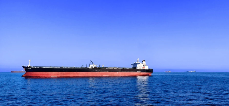 a large ship in the middle of the ocean, blue sky, taken with a pentax k1000, arabia, profile pic