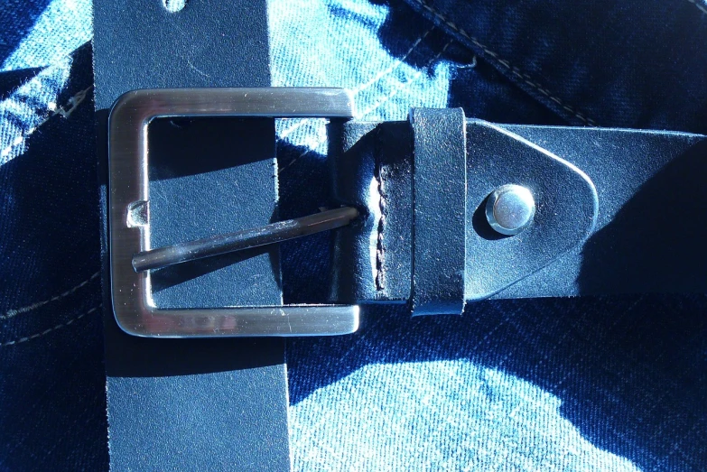 a close up of a belt on a person's jeans, pixabay, bauhaus, abstract black leather, shadow, ! low contrast!, shot on a 2 0 0 3 camera