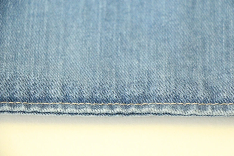 a close up of a pair of blue jeans, a pastel, superflat, tonal topstitching, wideshot, side view close up of a gaunt, widescreen