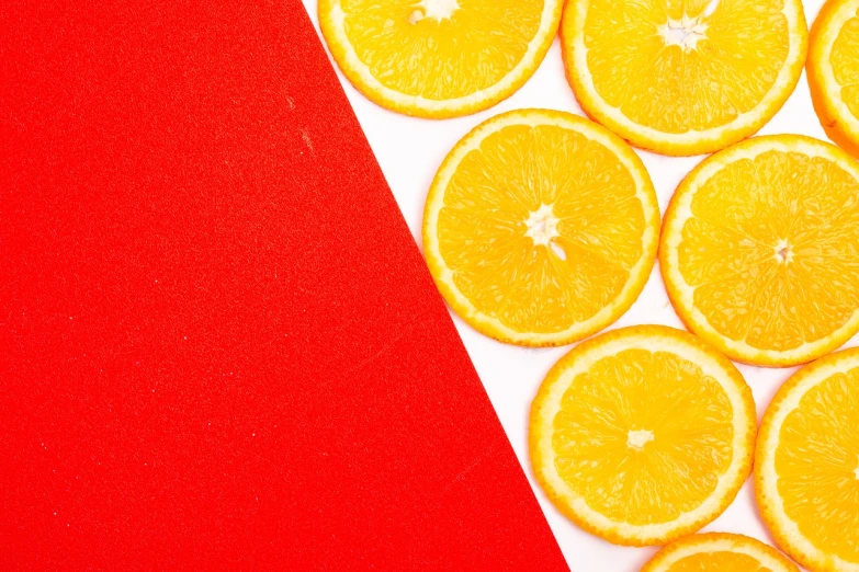 a white plate topped with sliced oranges on top of a red table, a picture, by Joseph-Marie Vien, trending on unsplash, postminimalism, 🐿🍸🍋, vibrant patterns, half image, 🦩🪐🐞👩🏻🦳