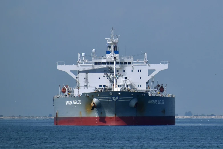 a large boat floating on top of a body of water, a portrait, ship at sea, crude, watch photo, front angle