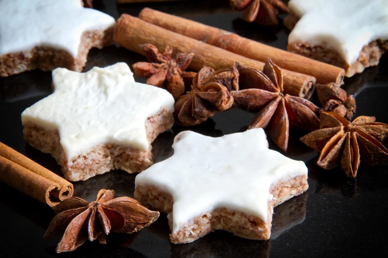 a close up of some food on a table, inspired by Caspar van Wittel, twinkling stars, cinnamon, frosted, beautiful stars