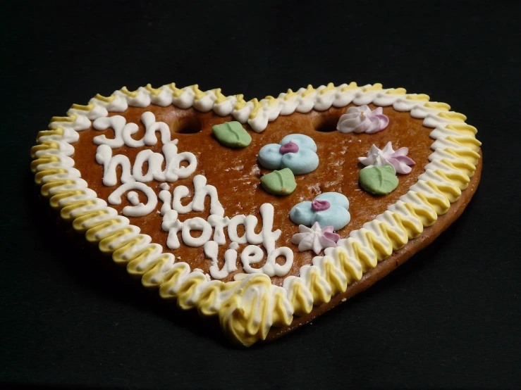 a close up of a heart shaped cookie on a table, inspired by Adolf Hölzel, folk art, zdislav beksinsk - h768, orthodox, birthday, 8 khd