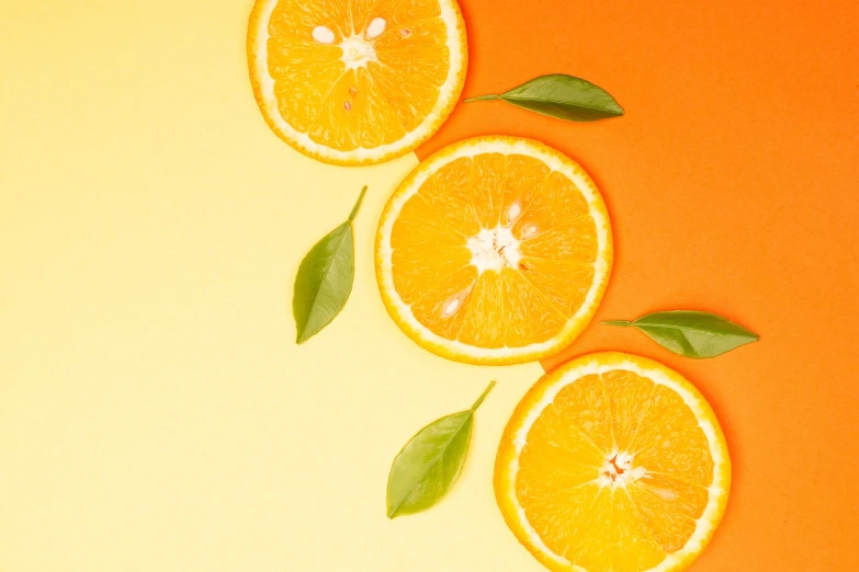 three slices of orange with leaves on an orange background, by Tadashi Nakayama, trending on unsplash, realism, background image, stock photo, 🐿🍸🍋, vibrant & colorful background
