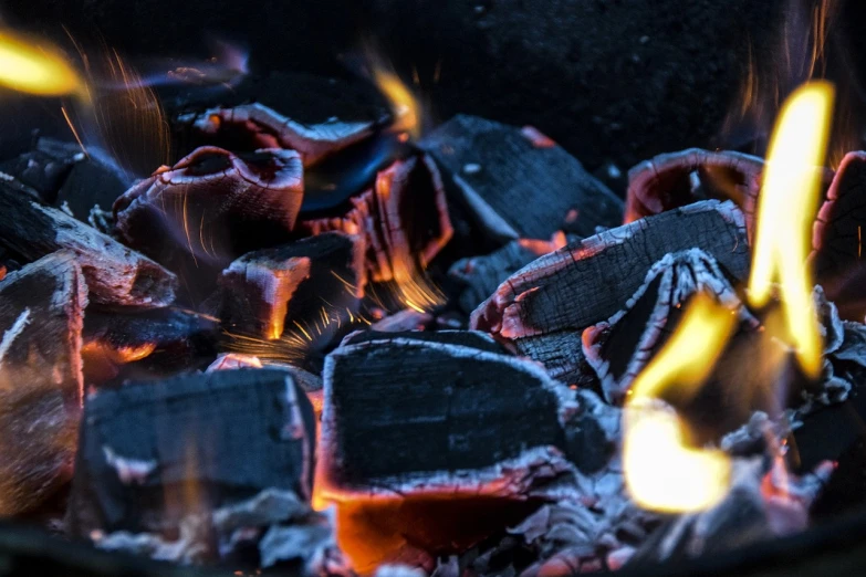 a close up of a fire in a grill, by Jan Konůpek, pexels contest winner, auto-destructive art, bog oak, ✨🕌🌙, barbecuing chewing gum, shaded