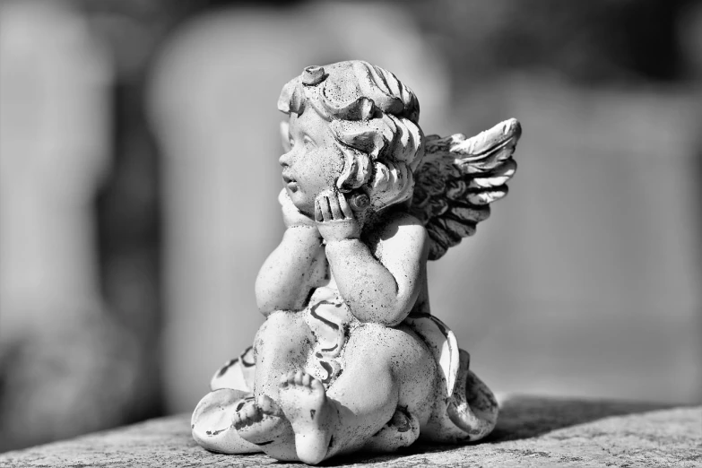 a black and white photo of a statue of an angel, pixabay contest winner, cute photo, resting on a tough day, hear no evil, phone photo