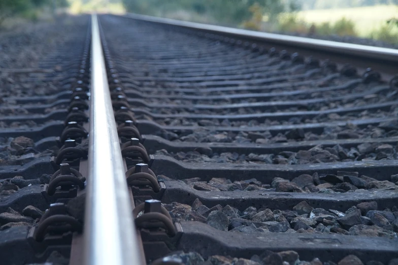 a close up of a train track on a sunny day, pixabay, realism, facing sideways, concise lines, neck zoomed in, hi-res photo