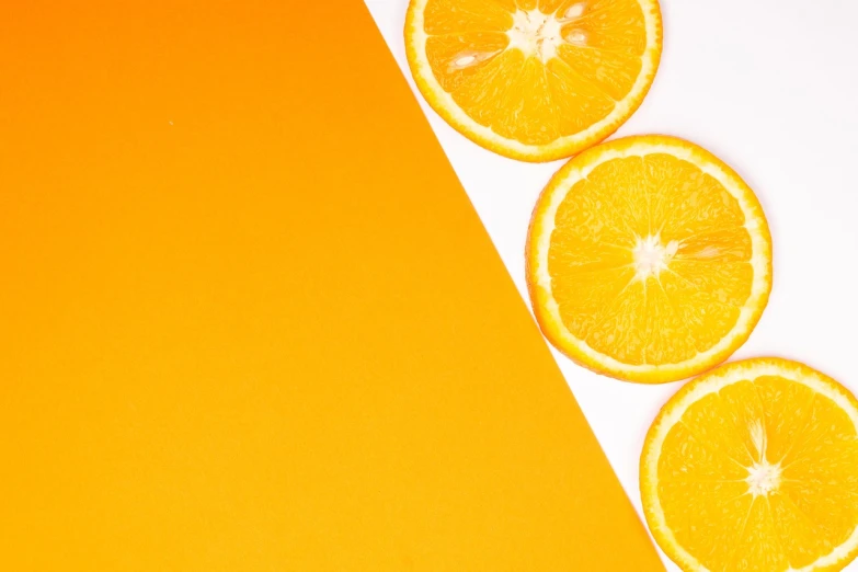 a group of orange slices sitting next to each other, postminimalism, 🐿🍸🍋, yellow and orange color scheme, thumbnail, white and orange