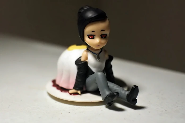 a figurine of a woman sitting on a plate, inspired by Nara Yoshitomo, flickr, shiro from deadman wonderland, hisoka, maid, with black hair