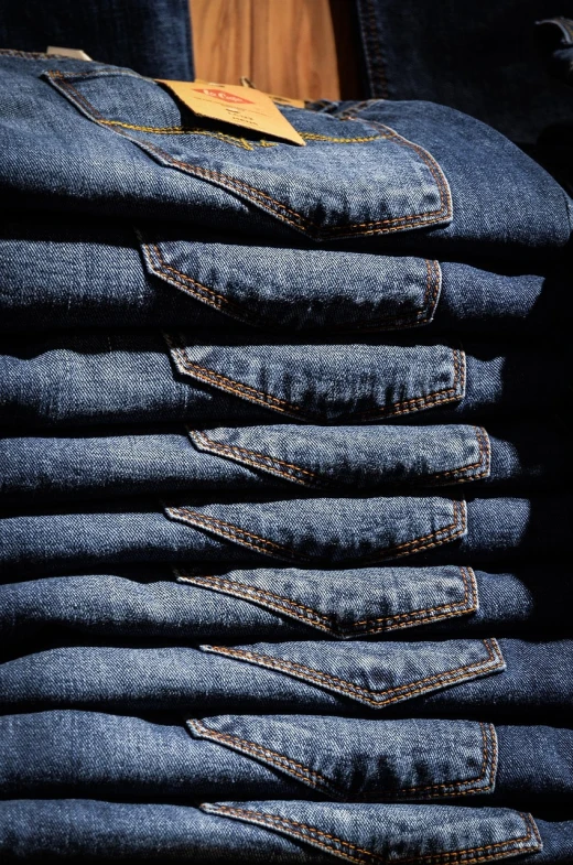 a stack of jeans sitting on top of each other, a photo, by Thomas Häfner, renaissance, backlit, usa-sep 20, modern high sharpness photo, mexico