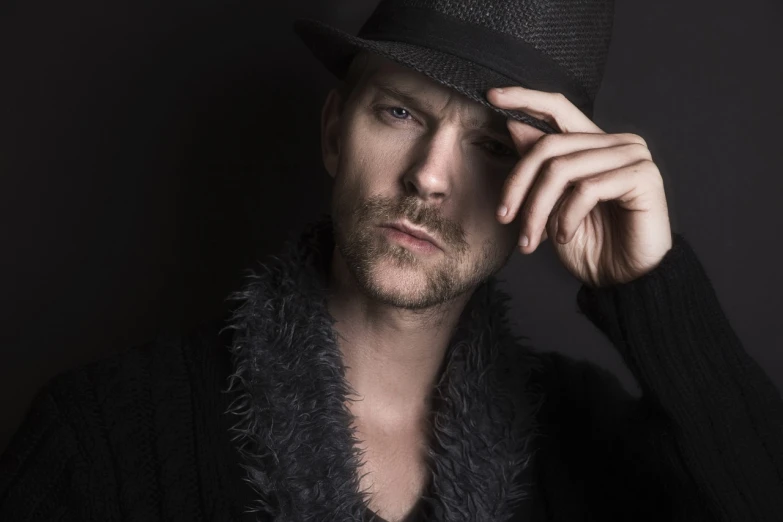 a close up of a person wearing a hat, a character portrait, inspired by Niklaus Manuel, sexy masculine, sean harris, glamour shot, ryan dening