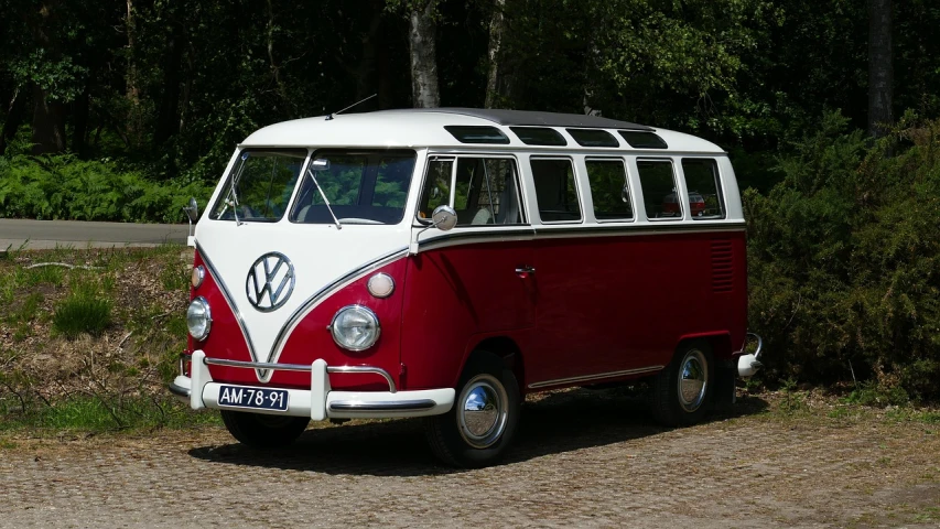 a red and white vw bus parked on the side of the road, by Edward Clark, pixabay, retrofuturism, soft top roof raised, shiny and sparkling, with a roof rack, front and side view