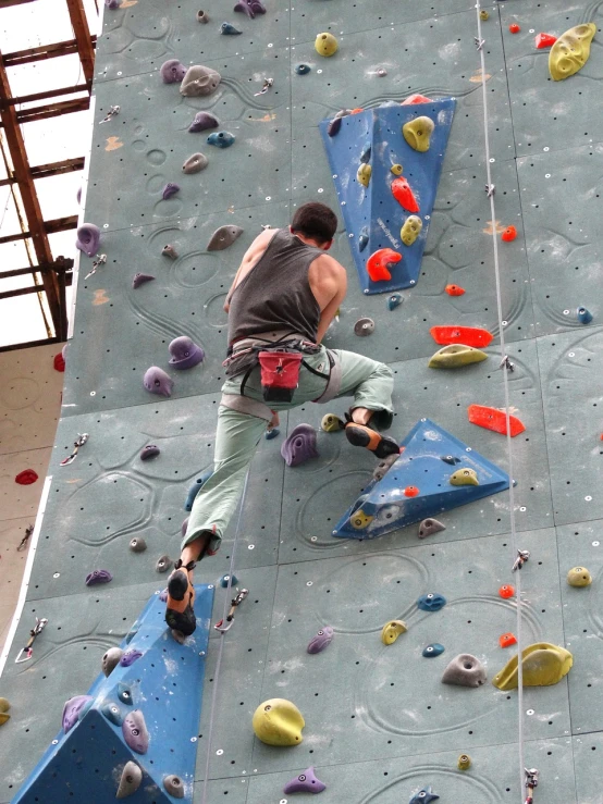 a man climbing up the side of a climbing wall, flickr, 3 4 5 3 1, eyes!, skeleton climbing, vsx