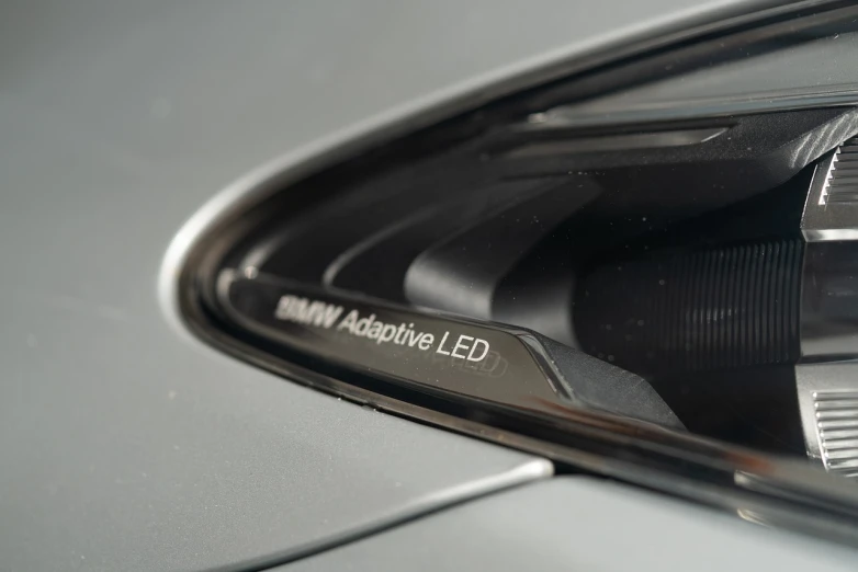a close up of a car's side view mirror, inspired by João Artur da Silva, adaptive armor, led light accents, acronym, # e 4 e 6 2 0