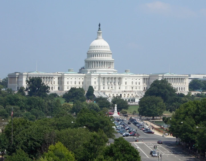 a large white building with a lot of trees in front of it, by Tom Carapic, flickr, capitol building, overlooking, the photo shows a large, mini