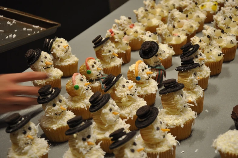 a table topped with cupcakes covered in frosting, by Susan Heidi, reddit, award - winning crisp details ”, frosty, cutest, chris moore”