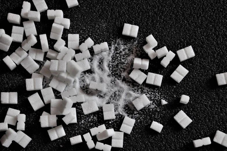 a pile of sugar cubes sitting on top of a table, an illustration of, by Hiroyuki Tajima, pexels, corps scattered on the ground, teeth gritted, hedi slimane, 3 2 x 3 2