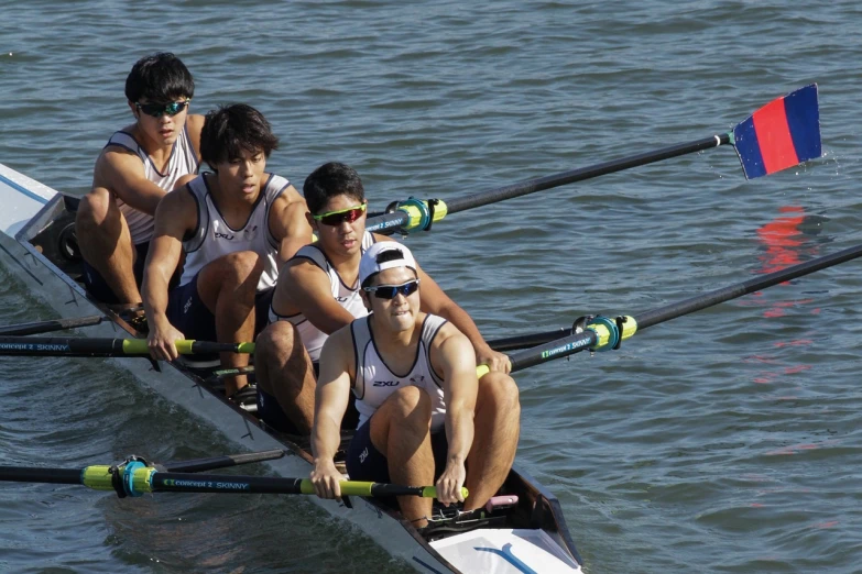 a group of people riding on top of a boat, a portrait, by Byron Galvez, flickr, sports photo, sculls, carlos huante and doug chiang, cute boys