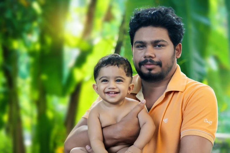 a man holding a baby in his arms, a picture, by Max Dauthendey, avatar image, 2 years old, group photo, archan nair