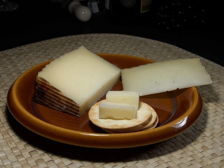 a plate of cheese and crackers on a table, inspired by Josefina Tanganelli Plana, flickr, dau-al-set, shaded, trio, soap, spain